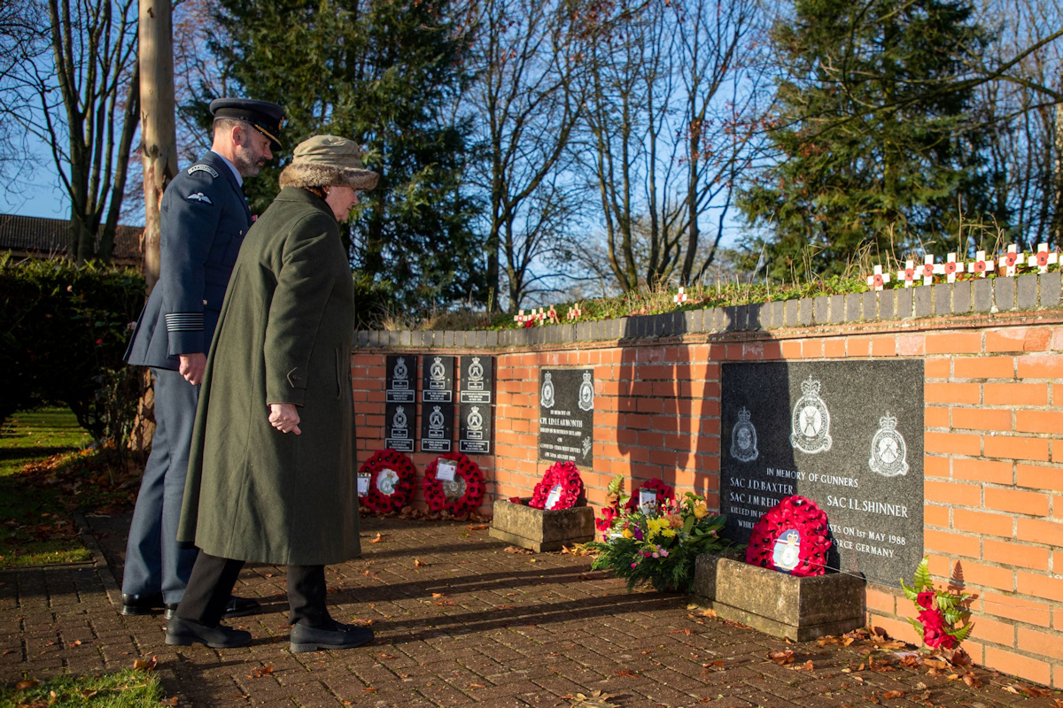 Lady Clare lays a wreath at the Station Memorial Garden joined by Station Commander Gp Capt Holland 